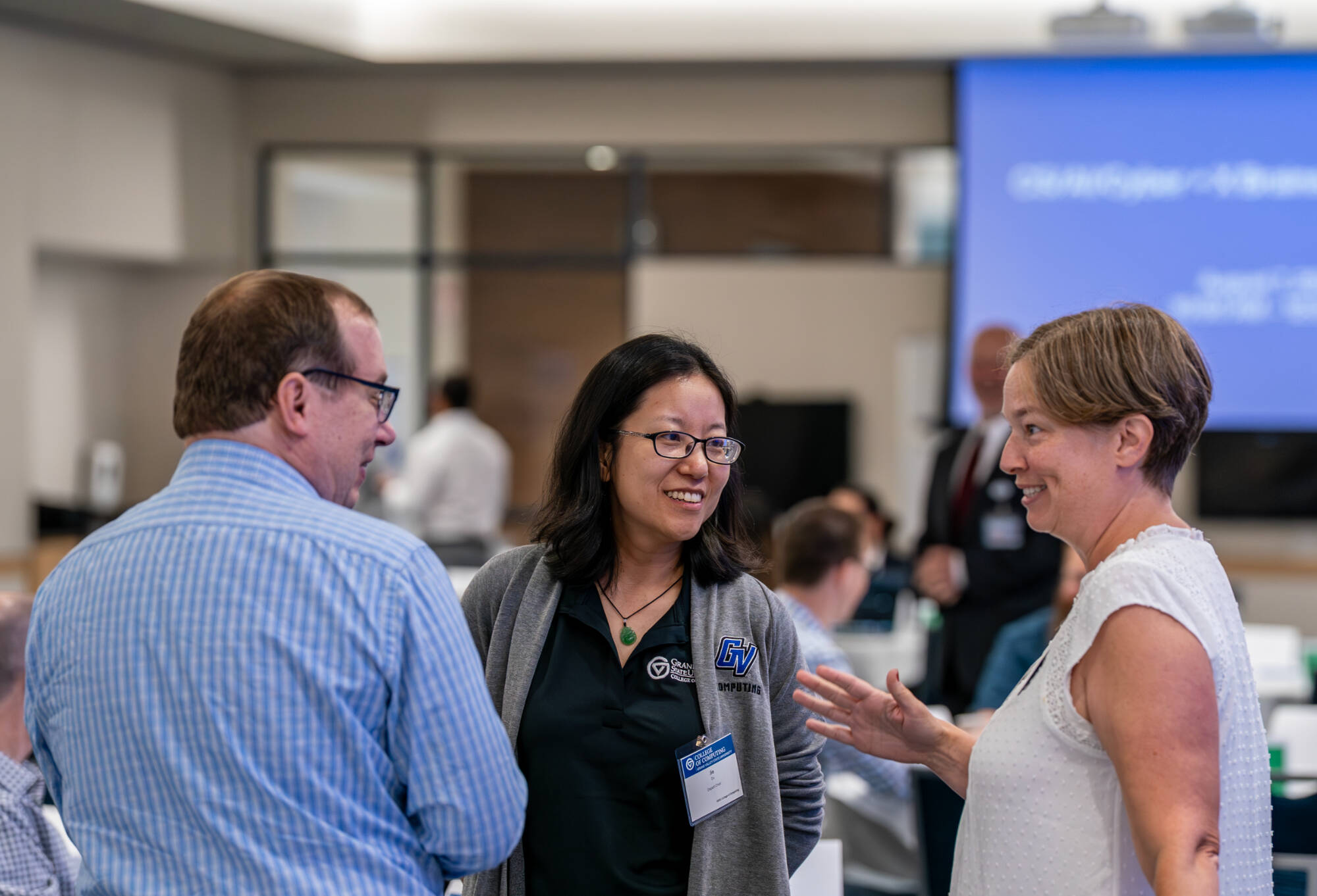 (From left) Andrew Kalafut, Jie Du and Marsely Kehoe during a College of Computing brainstorming session at the DeVos Center for Interprofessional Health.